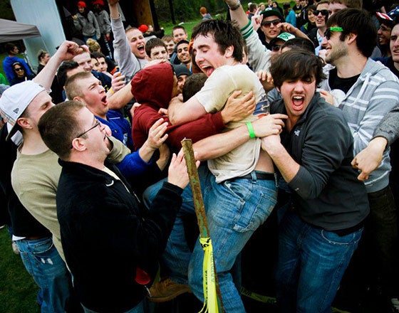 Group huddle of fraternity brothers