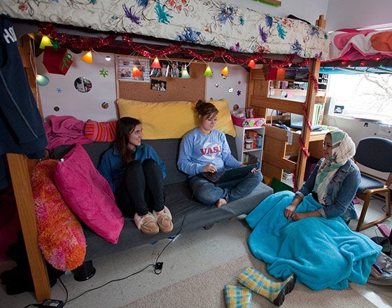Students sitting in their dorm room hanging out