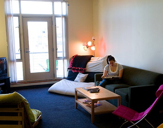 Student sitting in one of the common rooms studying