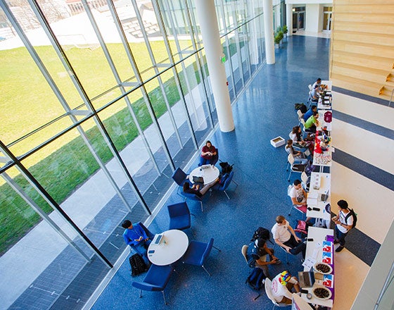 Inside of the Tink looking down from the second story at students eating their lunches