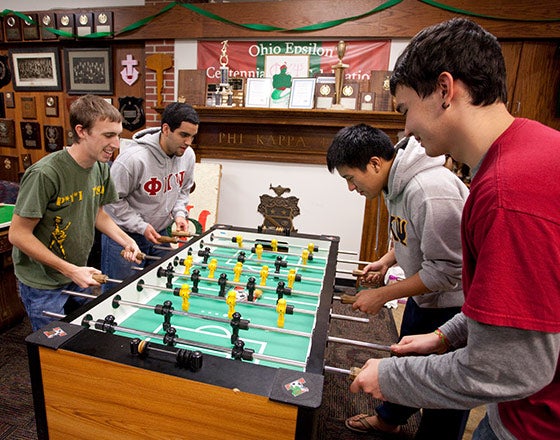 Students playing foosball