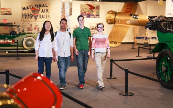 history-center-auto-museum A group of four students walking through the Cleveland History Center Auto Aviation Museum