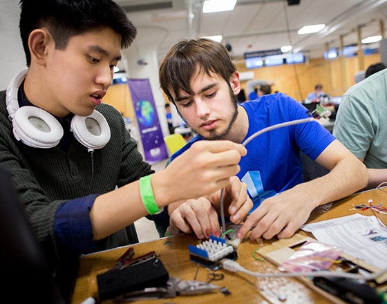 Two students working together on a project