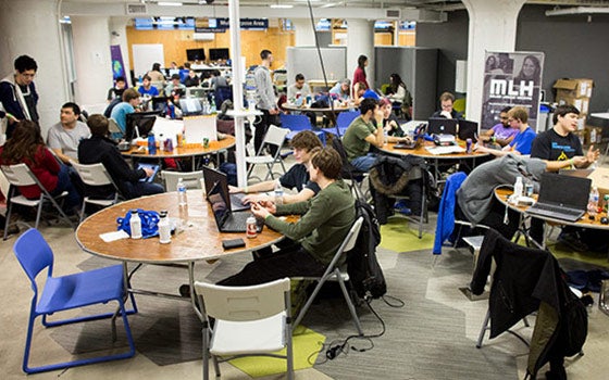 Group of students collaborating on a project at think[box]