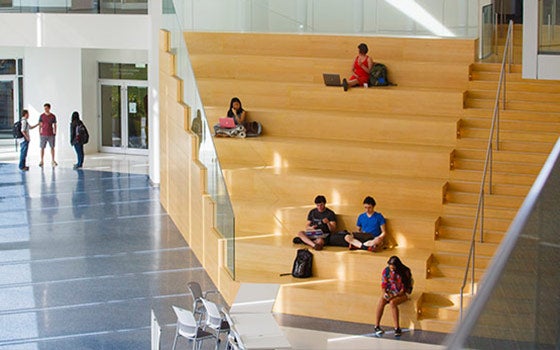 Students sitting on the stairs in the Tink