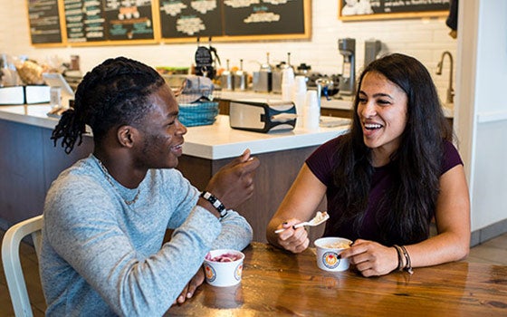 Two students eating ice cream at Mitchell's
