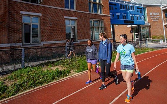 Students walking on the track at Wyant