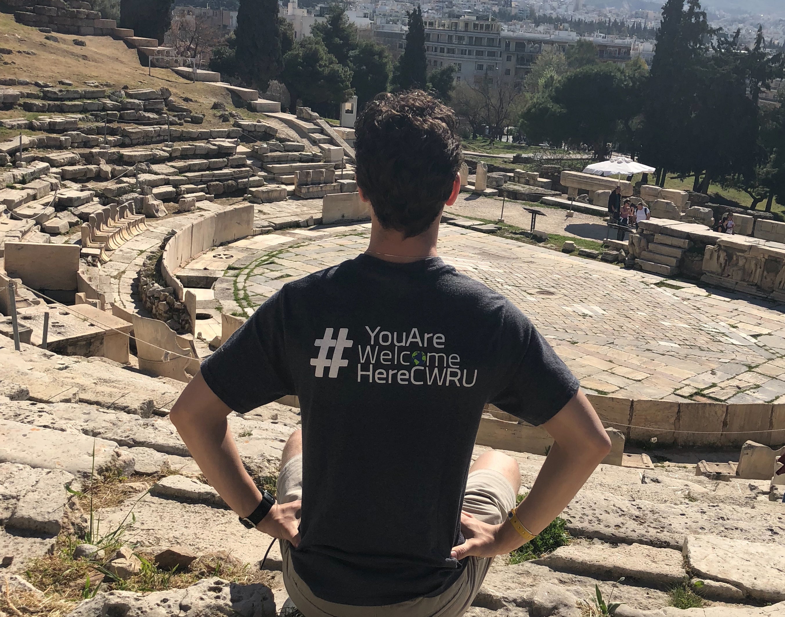 Back of a student with a CWRU shirt overlooking a desert