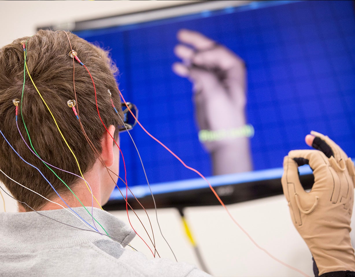 Student conducts research with hand sensors