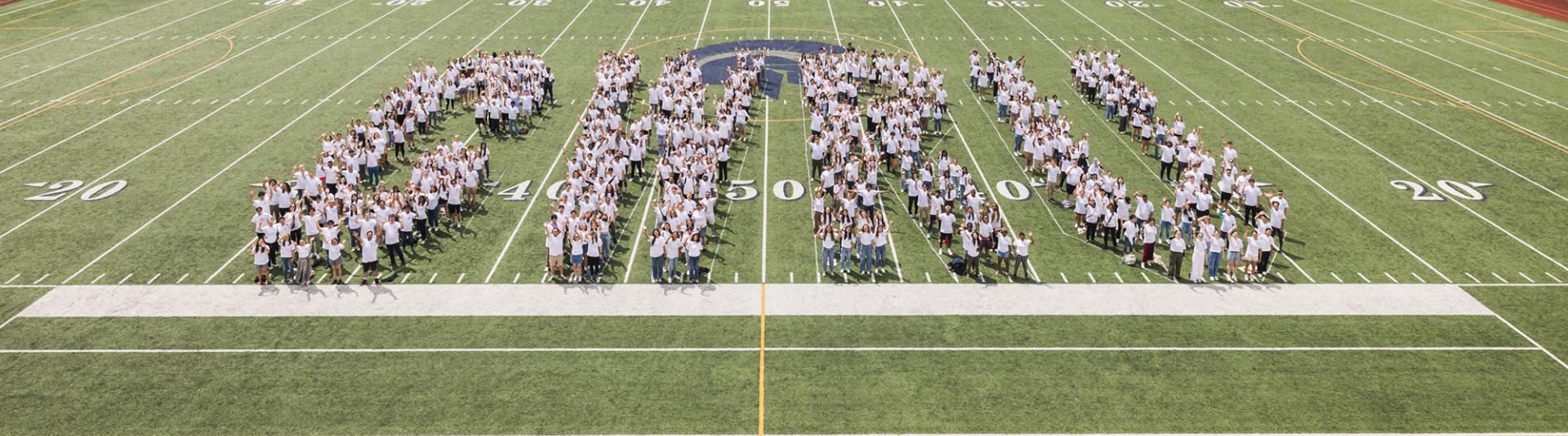 CWRU class forms letters on a field.