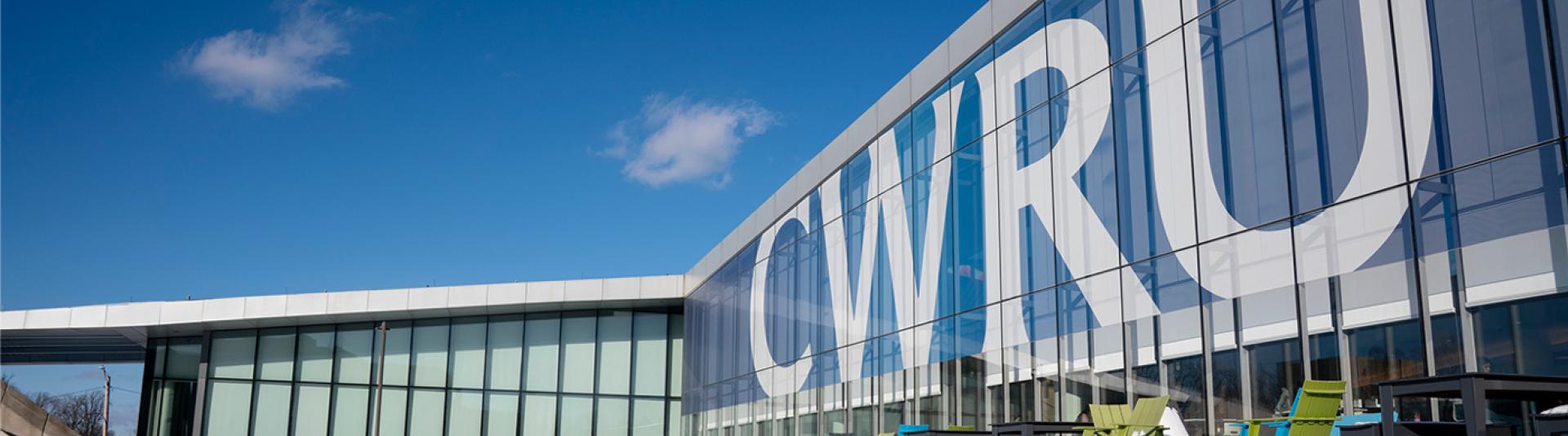 Large CWRU letters on campus building.