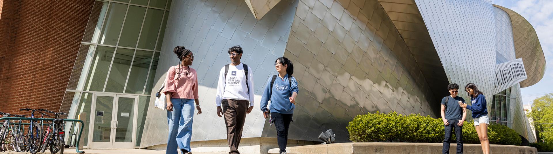 Students walk together away from the Weatherhead building.