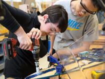 Students using power tools in the thinkbox