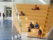Students sitting on the stairs in the Tink