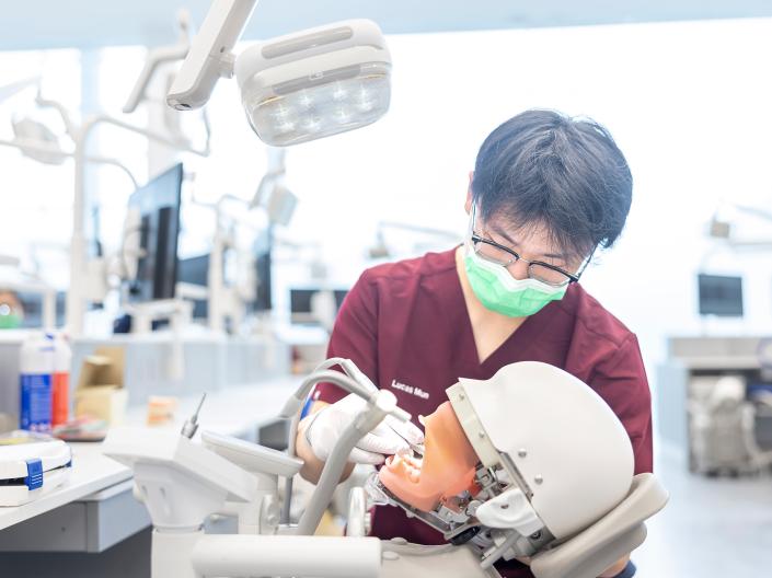 Student working on a dental simulation.