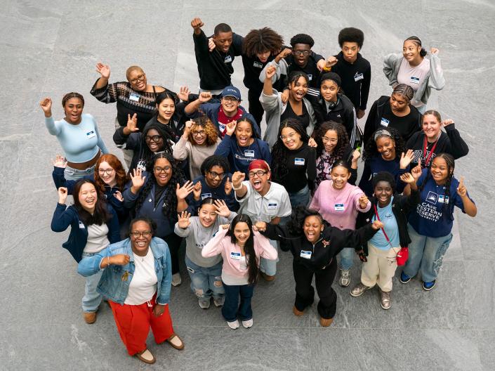 Nursing students gather together with visiting high school students for an aerial group photo.