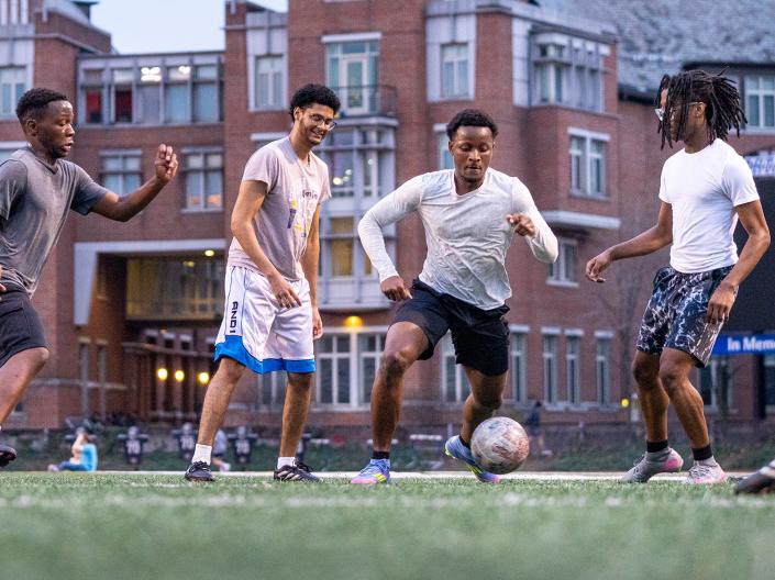 Students play soccer