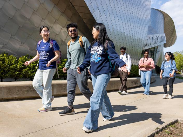 Students walking together on campus.