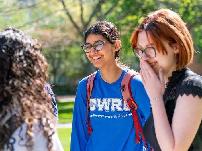Smiling female students talking.