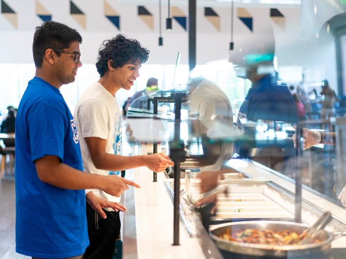 Students select food options from the buffet at one of the dining halls on campus.
