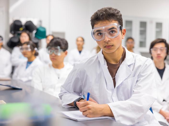 Students in lab coats.