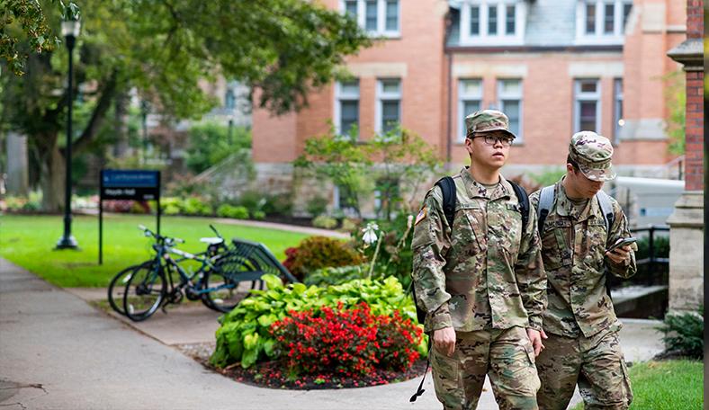 US Army Recruits standing on campus. 