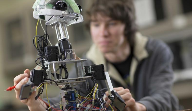 Case Western Reserve University student works on robot