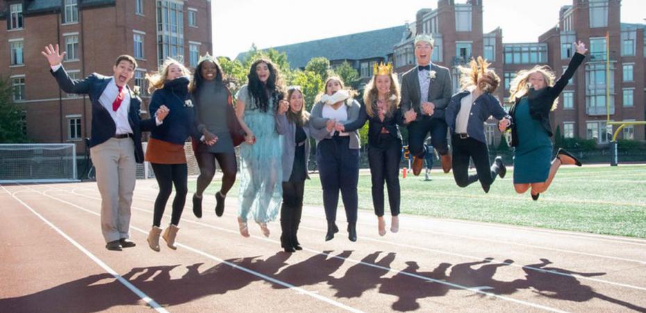 A group of CWRU students jumping and enjoying the time before graduation.  