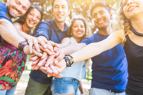 image of people with hands on top of each other