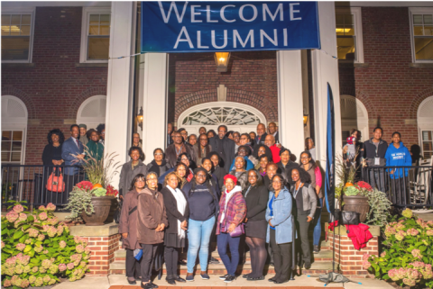 African American Alumni Association members poses in front of the Linsalata Alumni Center