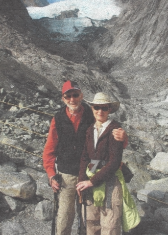 Ralph and Lynne Locher stand side-by-side while hiking outside