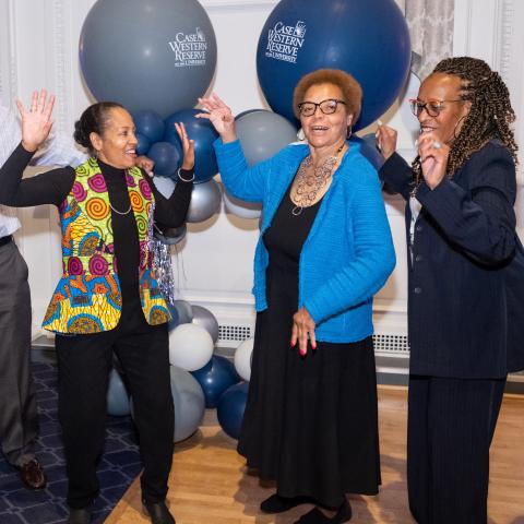 Three members of AAAA dance at homecoming 2022