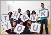 image of student holding letters spelling "thank you"