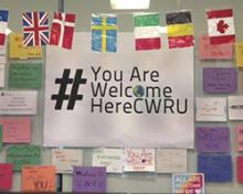 #YouAreWelcomeHereCWRU  surrounded by flags