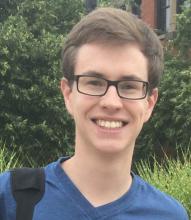 Headshot of Jacob Moran, smiling for the camera