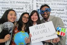 A group of international students celebrate graduation together.