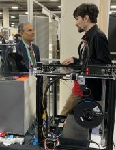 Venkataramanan “Ragu” Balakrishnan, Charles H. Phipps Dean, Case School of Engineering, meets with a CWRU student on the floor of CES 2020.