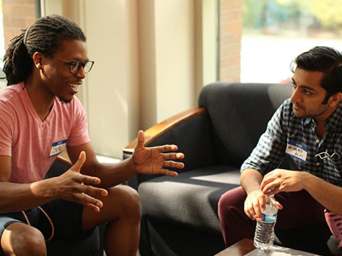 image of Sean Arsalan talking to a student
