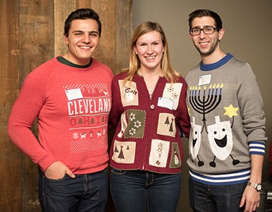 image of alumni in holiday sweaters