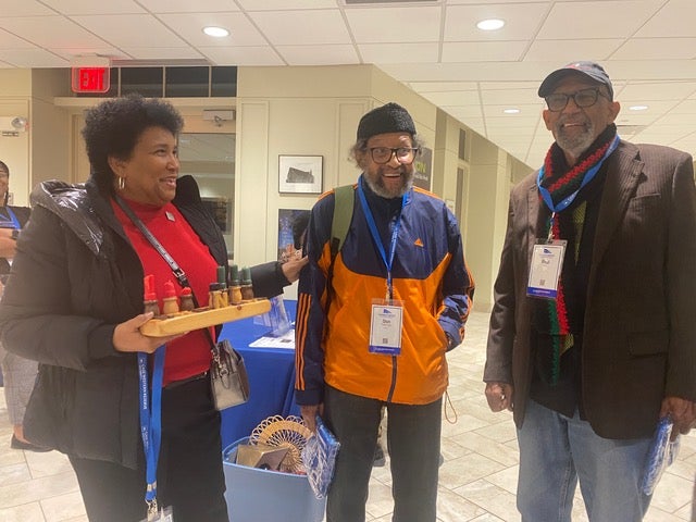 Vera Perkins-Hughes, Donald Freeman and Paul Hill Jr. laugh with each other and look at camera