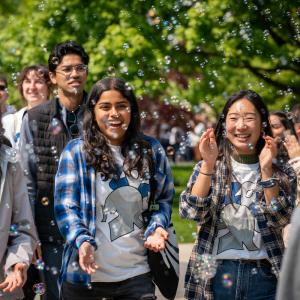 Graduates are celebrated with a clap-out on the quad and bubbles