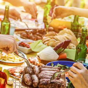 Stock image of a group enjoying a barbecue meal