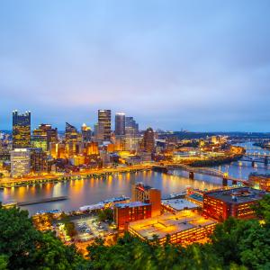 Pittsburgh skyline in the evening shown from an aerial perspective