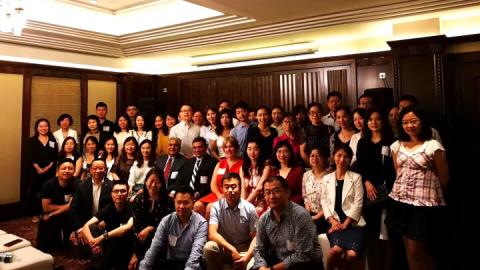 Group of CWRU students in Shanghai, smiling and posed for the camera with Dean Malhotra from Weatherhead