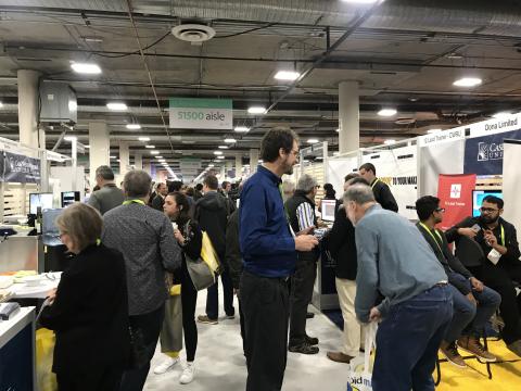 A group of alumni and students on the exhibition floor of the 2019 Consumer Electronics Show in Las Vegas