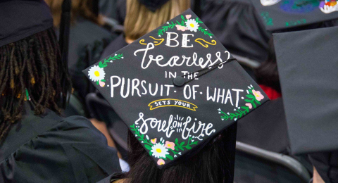 Decorated graduation cap at CWRU Commencement that says "Be Fearless in the Pursuit of what sets your soul on fire"