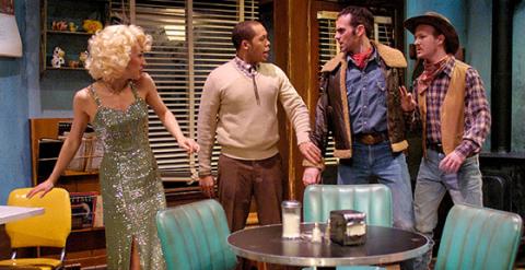 Four actors on stage during a performance at the Cleveland Play House