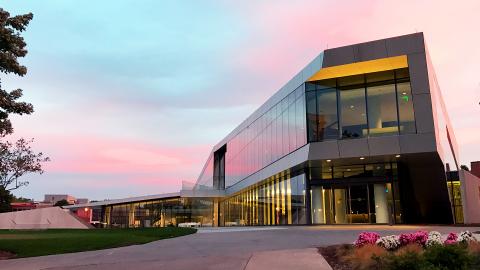 Exterior of the Tinkham Veale University Center at sunset