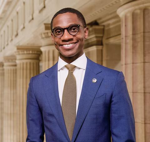 Justin Bibb smiles at camera while wearing formal attire