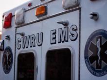 The back of a CWRU EMS ambulance that has CWRU EMS written on the doors